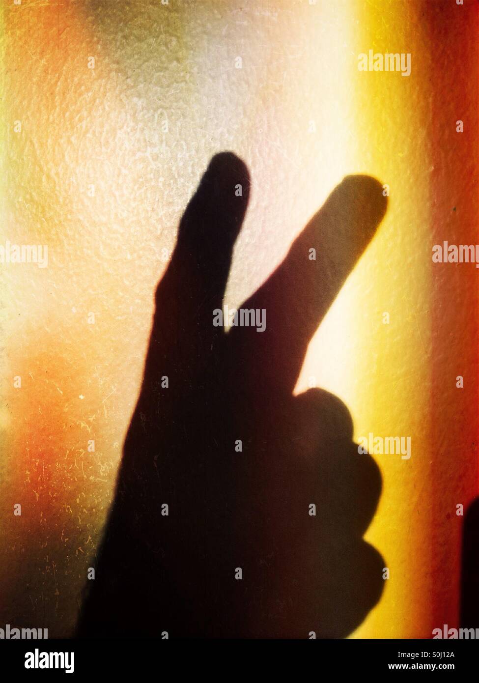 2 fingers in shadow silhouette - Smartphone Captured Stock Image
