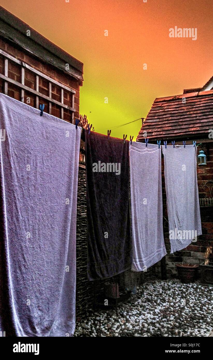 Washing on the line at sunset Stock Photo