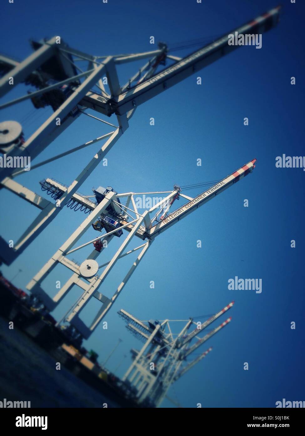 Container loading cranes at the container terminal of the port of Hamburg, Germany - Smartphone Captured Stock Image