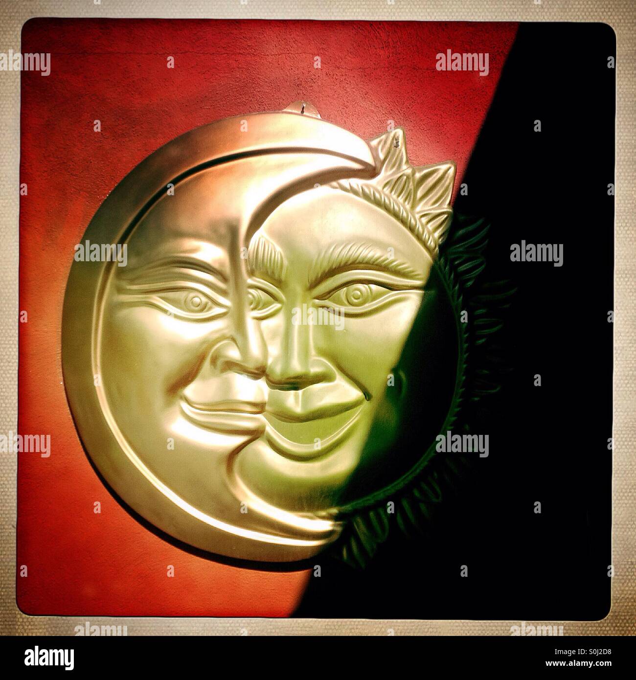 A folk art of the sun and the moon decorates a restaurant in Teotihuacan, Mexico - Smartphone Captured Stock Image