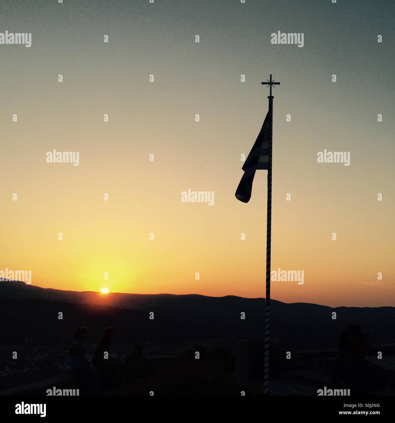 Greek flag at sunset. Stock Photo