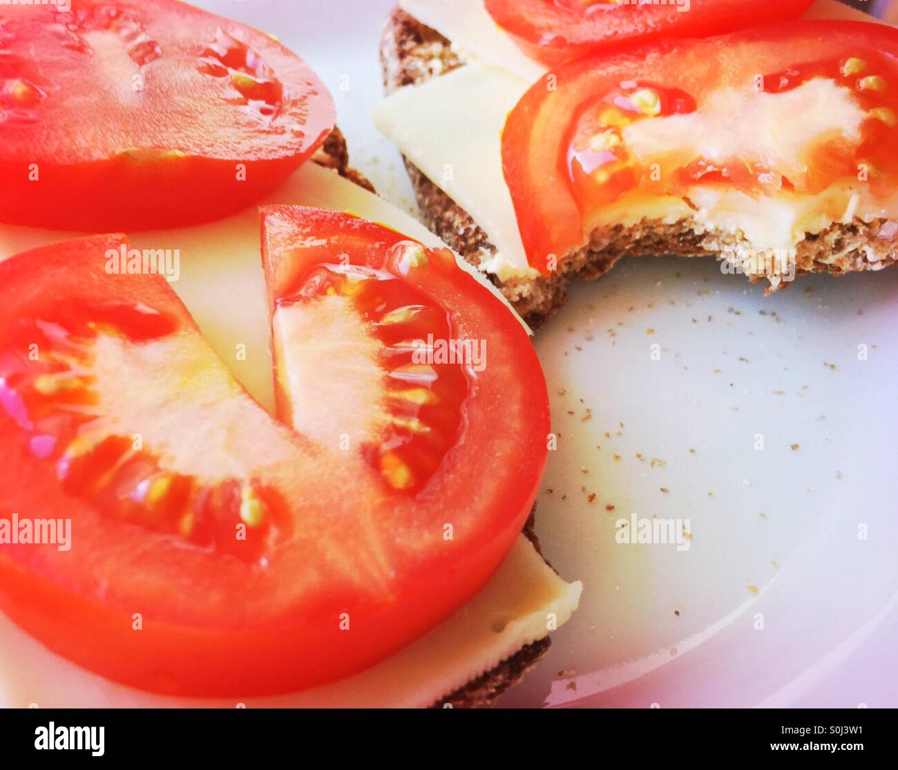 Dark bread with cheese and tomato - Smartphone Captured Stock Image