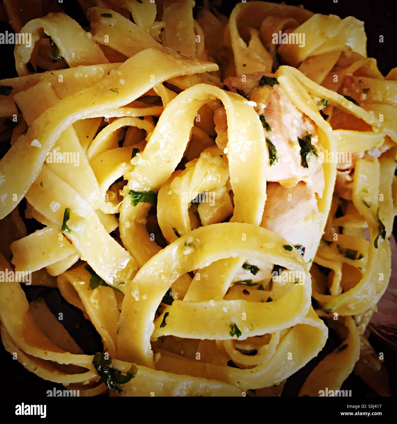 Fettuccine pasta with pesto and chicken - Smartphone Captured Stock Image