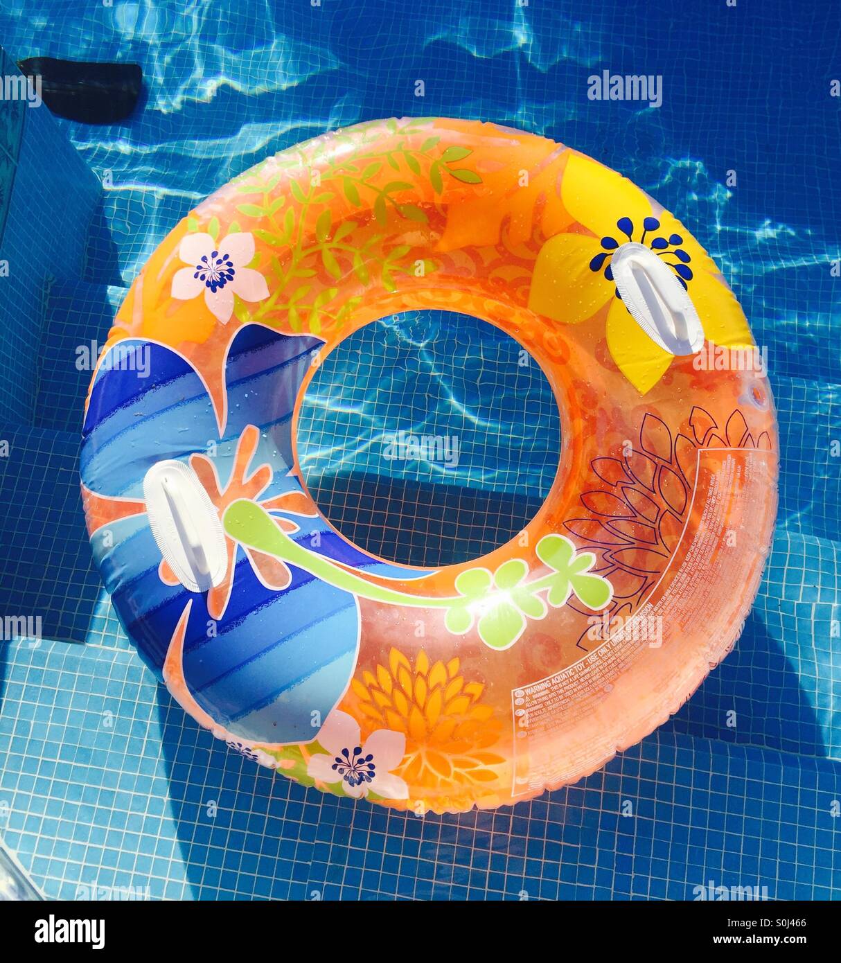 Rubber ring in pool Stock Photo Alamy