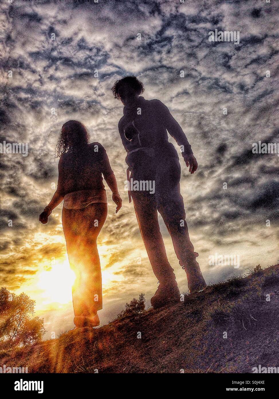 Two sisters at sunset - Smartphone Captured Stock Image