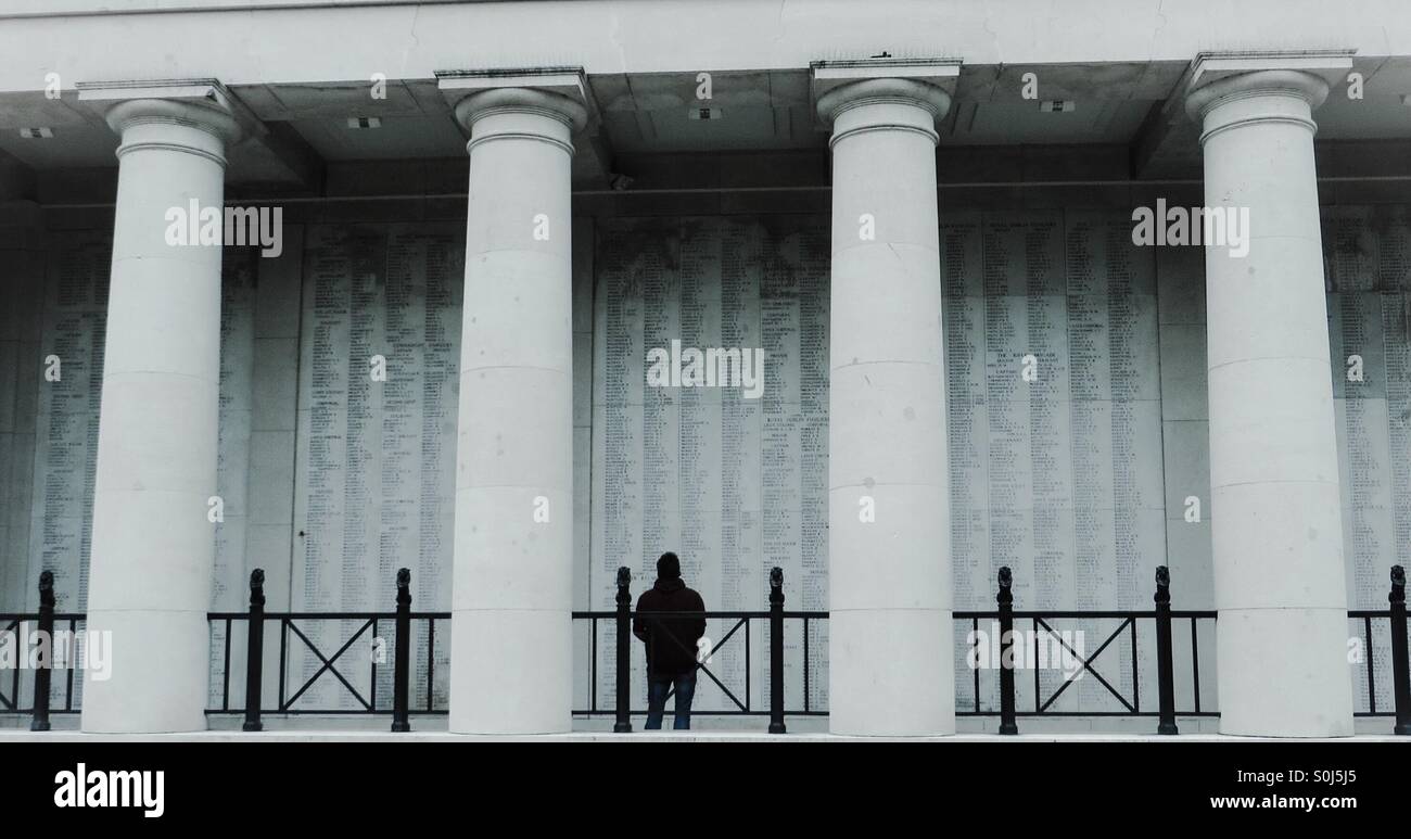 Man looking at the names on the Menin Gate Ypres Belgium - Smartphone Captured Stock Image