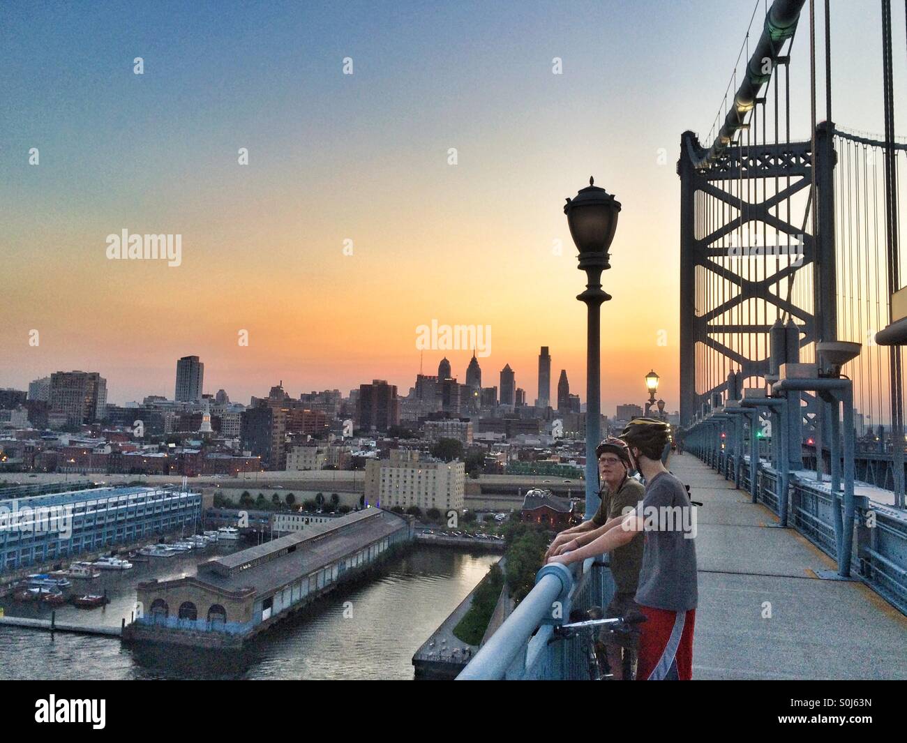 Father & Son on the Ben Franklin Bridge, Philadelphia, PA - Smartphone Captured Stock Image