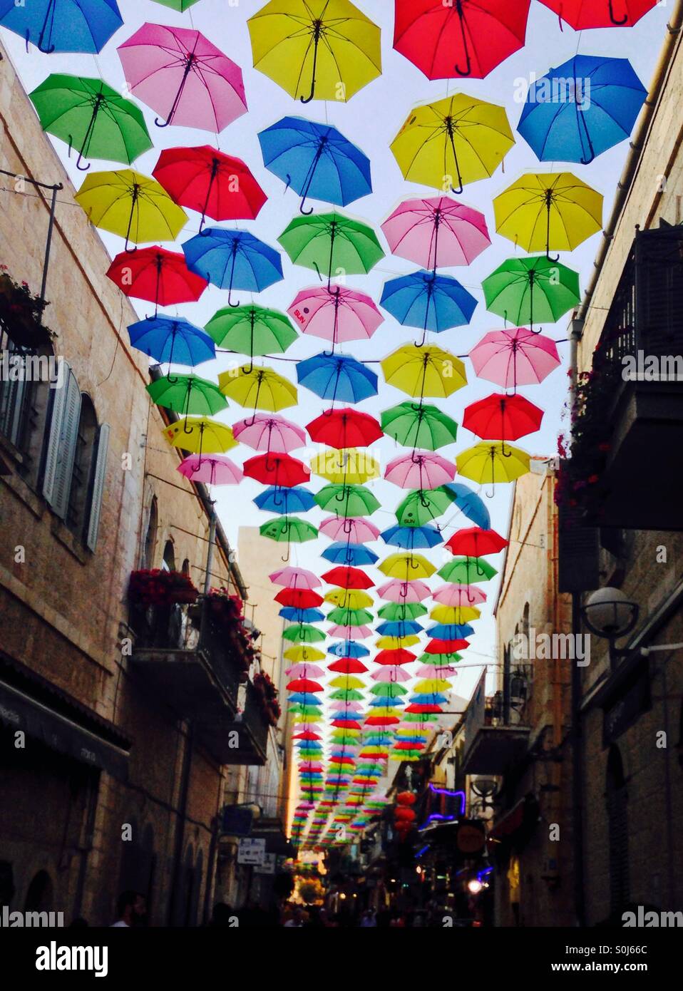 umbrellas lining street in jerusalem Stock Photo Alamy