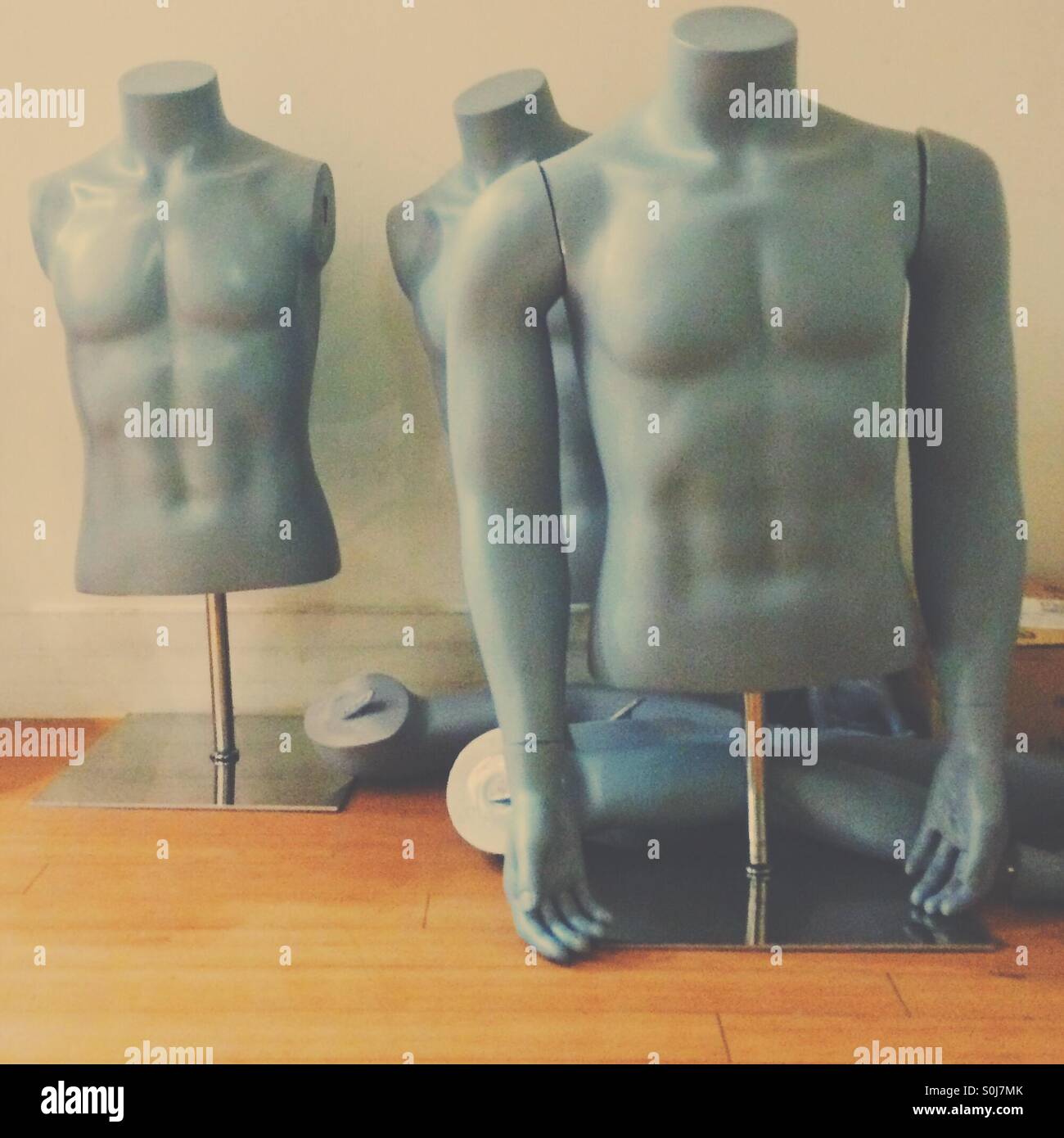 Discarded grey shop mannequins - Smartphone Captured Stock Image