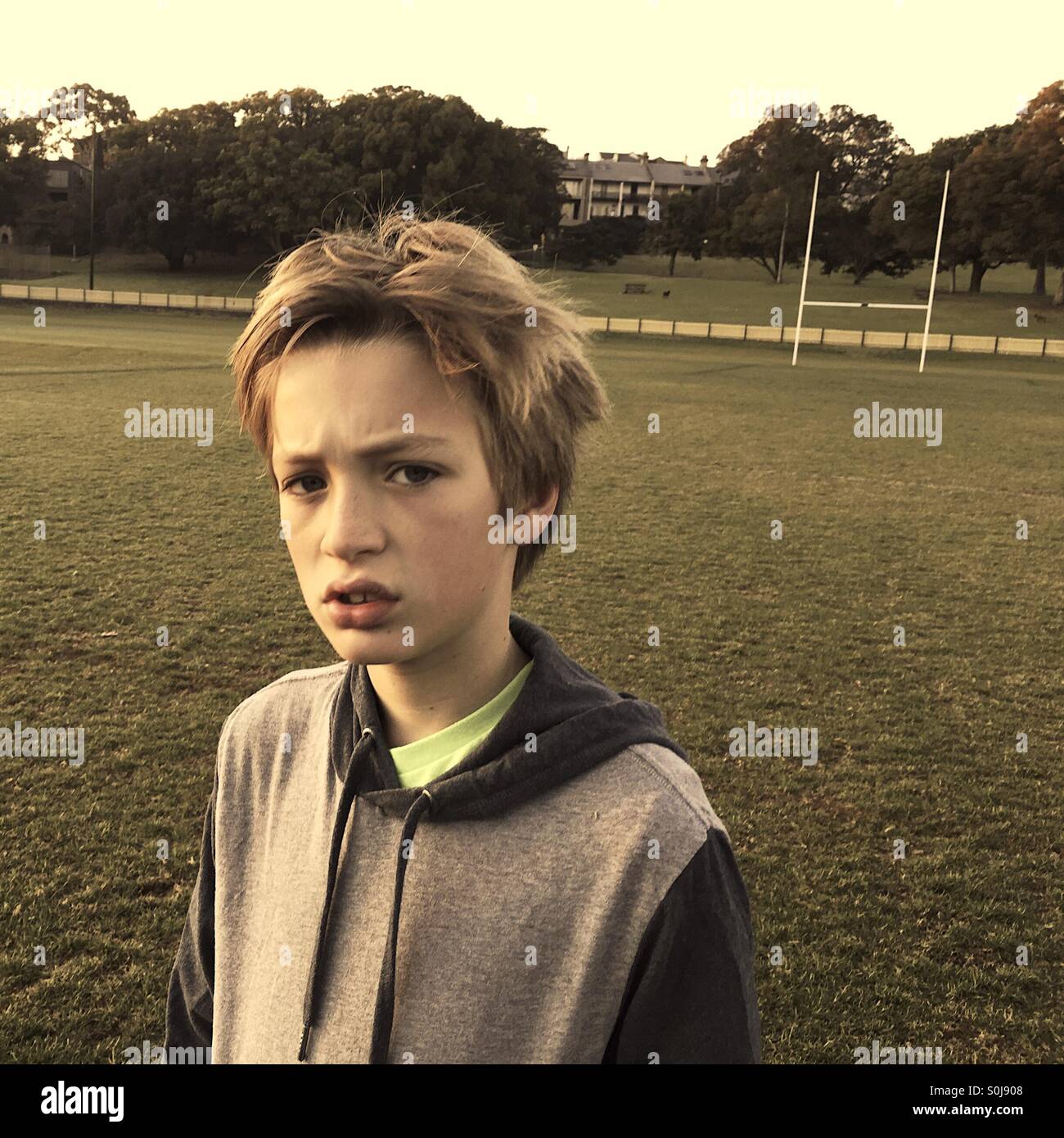 Boy on playing field - Smartphone Captured Stock Image