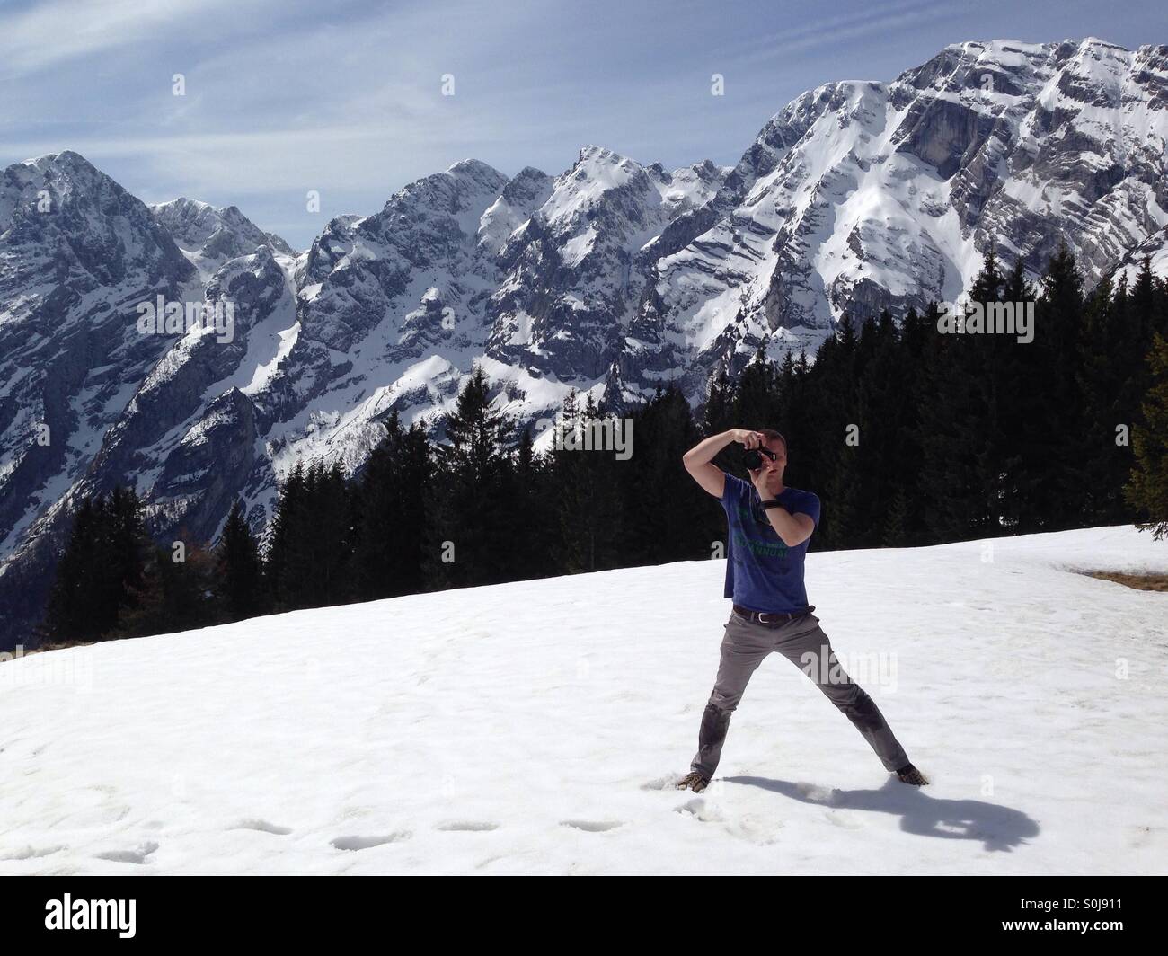 photographer and snowy mountains in germany Stock Photo