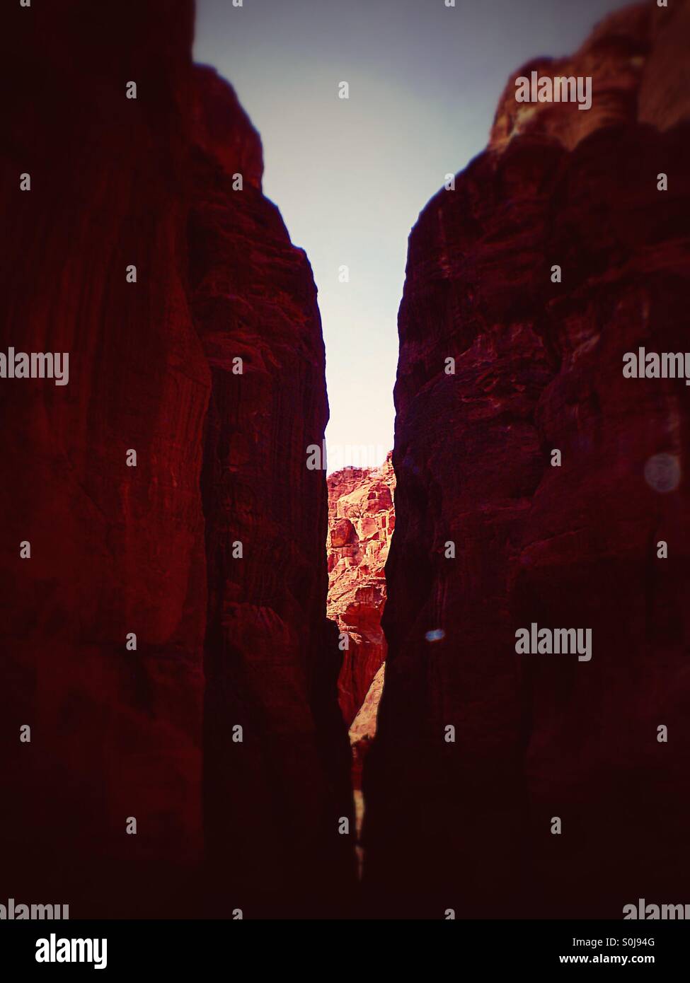 Walking through the rock walls last turn before The Treasury Petra Jordan - Smartphone Captured Stock Image