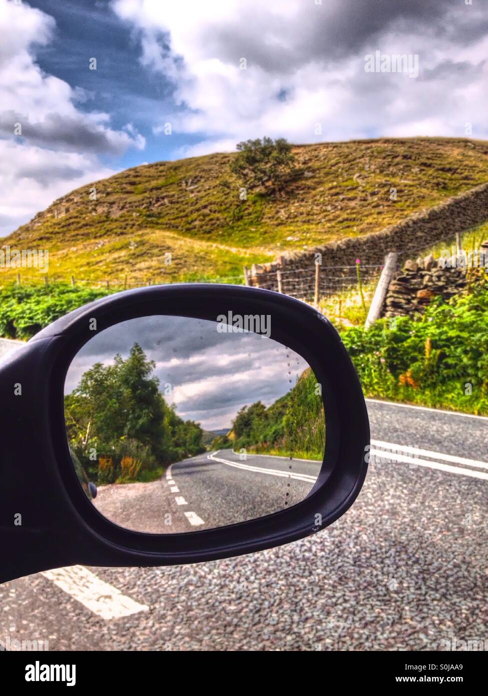 Road reflected in car wing mirror - Smartphone Captured Stock Image