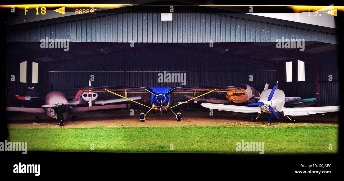 Light aircraft in a hanger Stock Photo