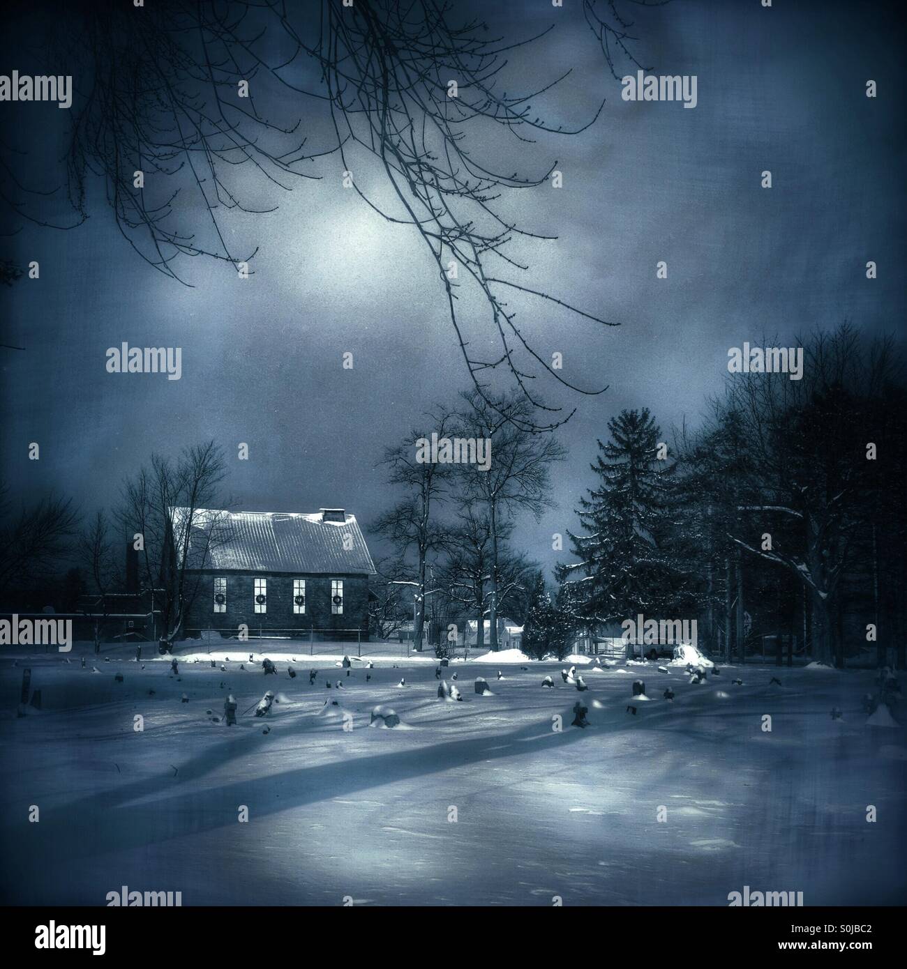 Cemetery and old schoolhouse in winter - Smartphone Captured Stock Image