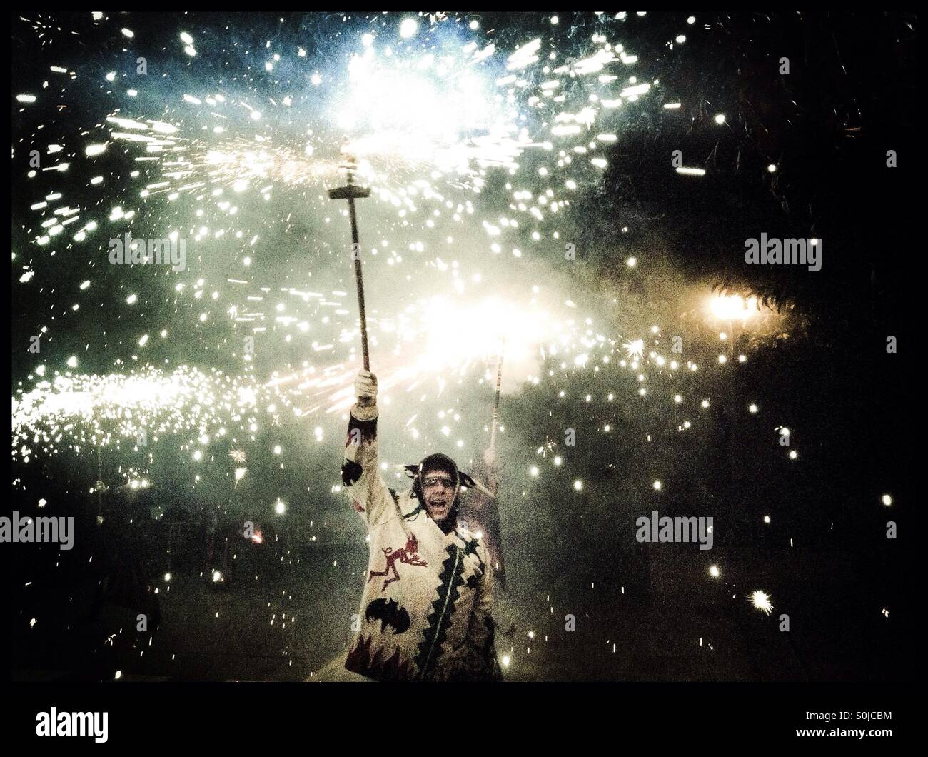 SPAIN: 23rd August 2015. Les Diables perform their firework dance marking the last night of the Fiesta Major in Ascó, Catalonia, Spain. - Smartphone Captured Stock Image