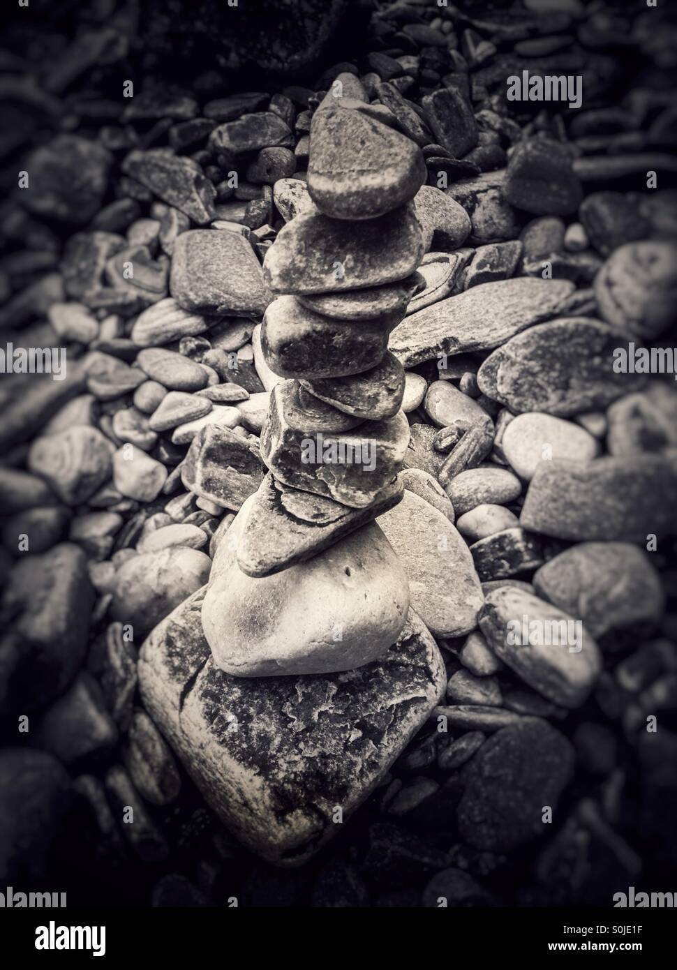 Stacked stones on the beach. Stone balance - Smartphone Captured Stock Image