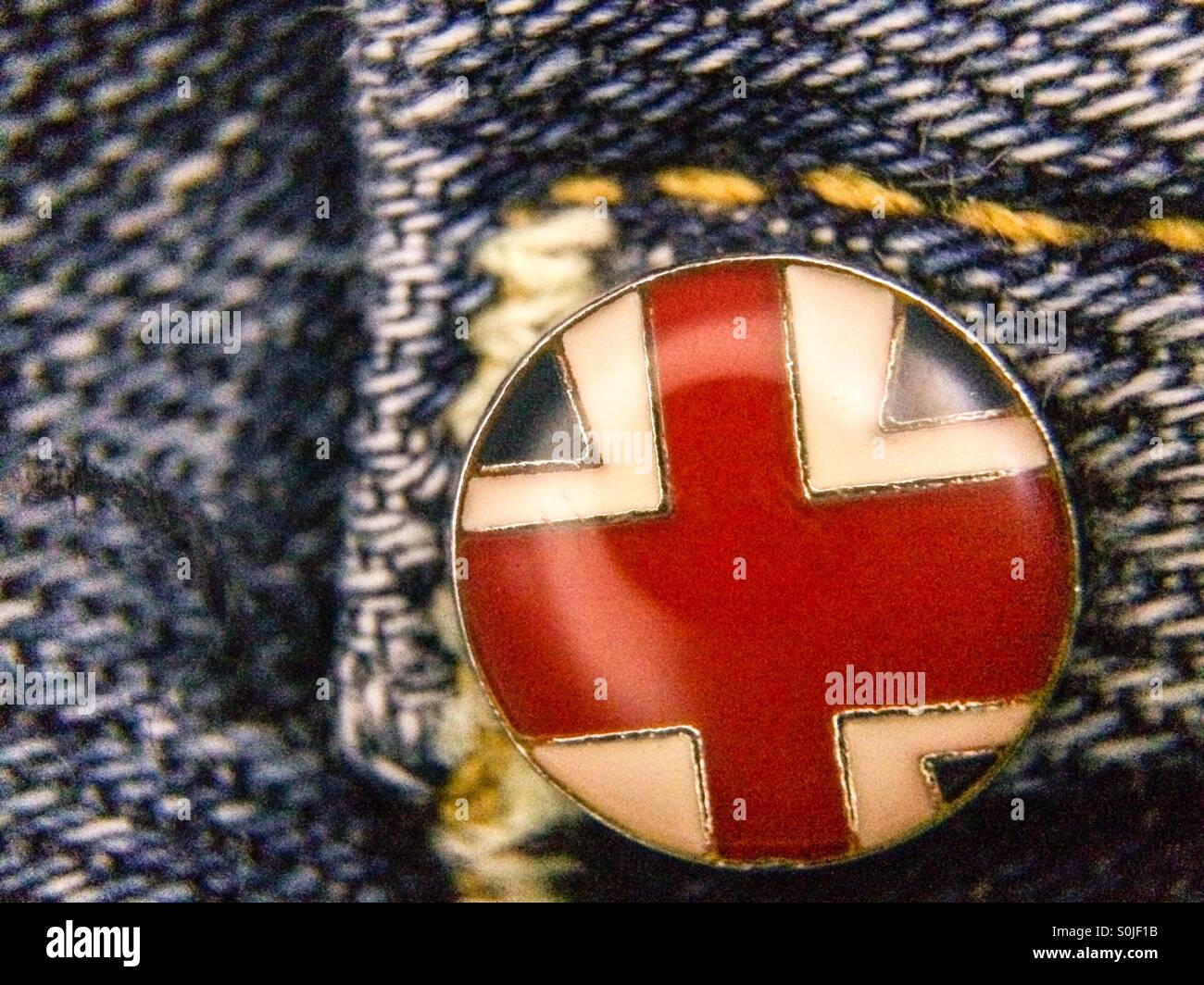 Macro view of a rivet on a pair of Hudson dungaree jeans - Smartphone Captured Stock Image