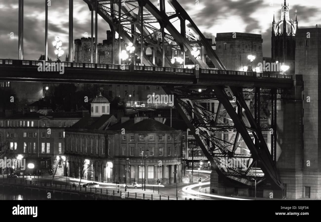 Light trails underneath the Newcastle Tyne Bridge at night. - Smartphone Captured Stock Image