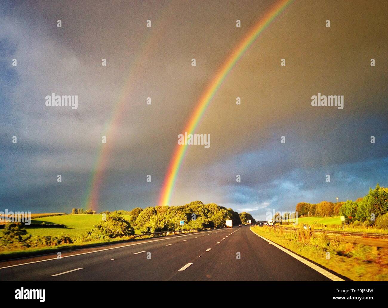 Double rainbow from motorway - Smartphone Captured Stock Image