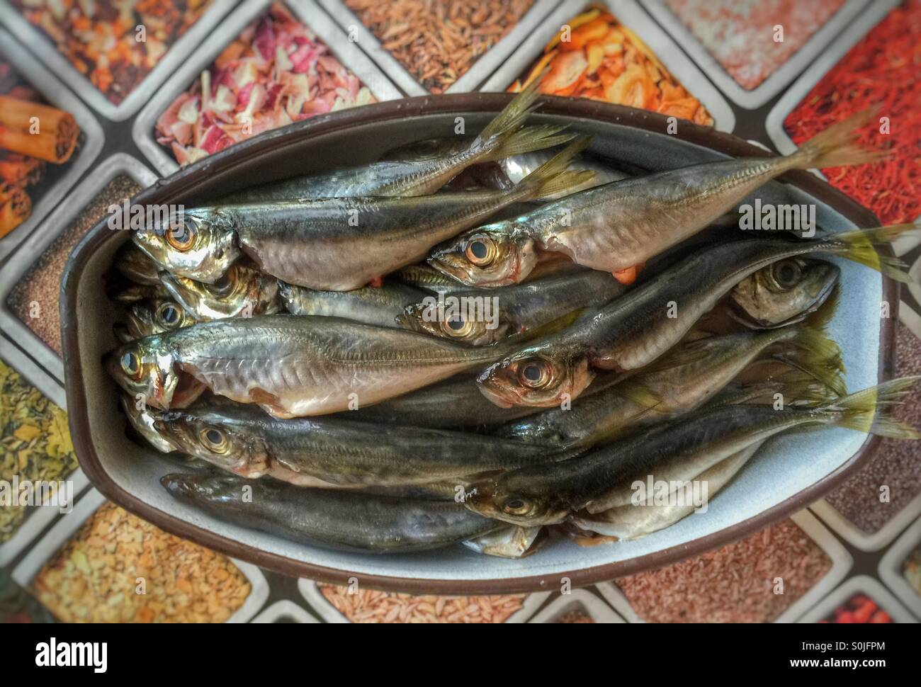 Raw fish in pan Stock Photo - Alamy