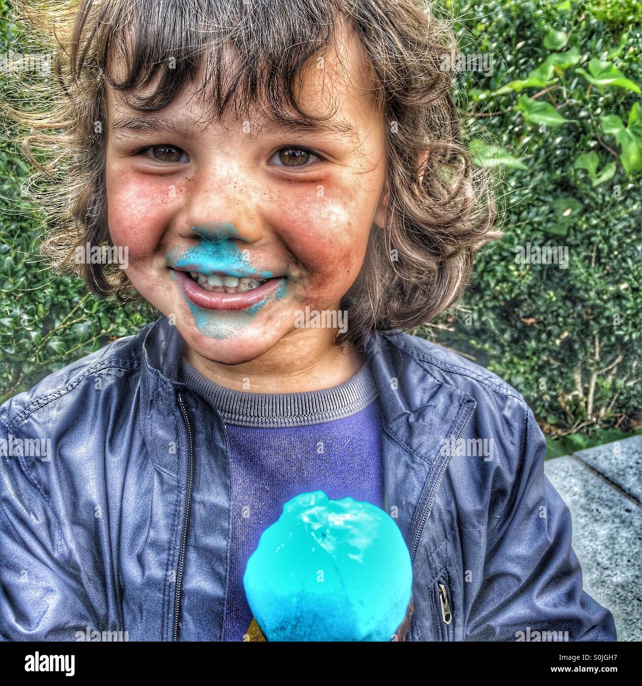 4 year old boy with blue ice cream cone - Smartphone Captured Stock Image