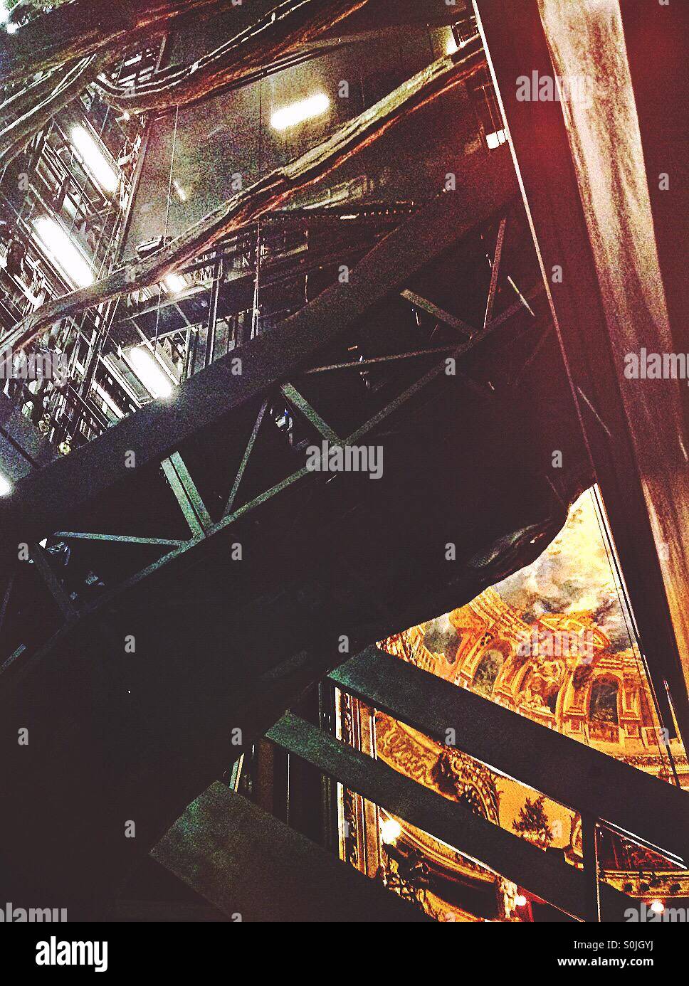 Backstage view of the opera scene, glimpsing the opera house seating area. - Smartphone Captured Stock Image