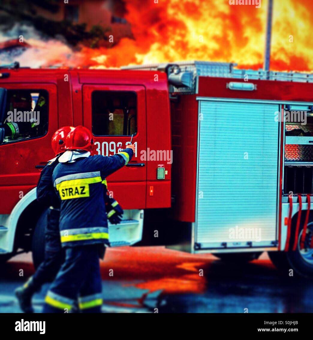 Fire brigade in action Stock Photo - Alamy