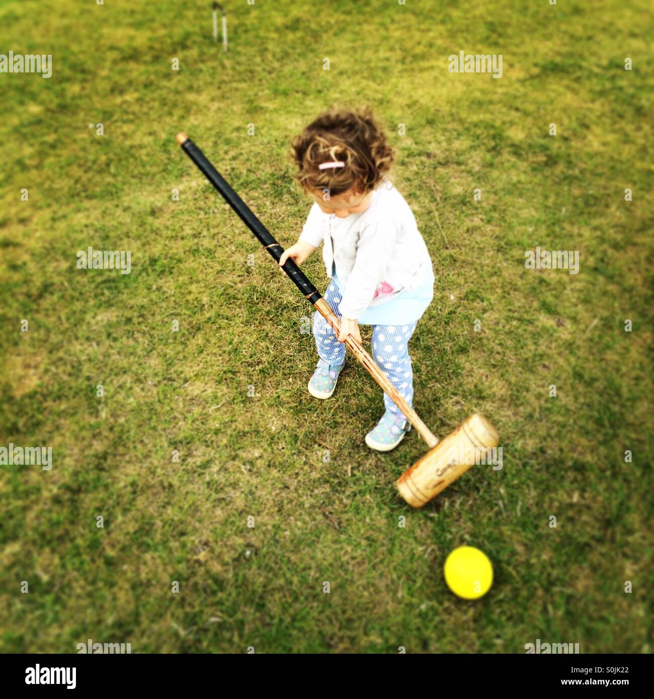 Toddler croquet Stock Photo