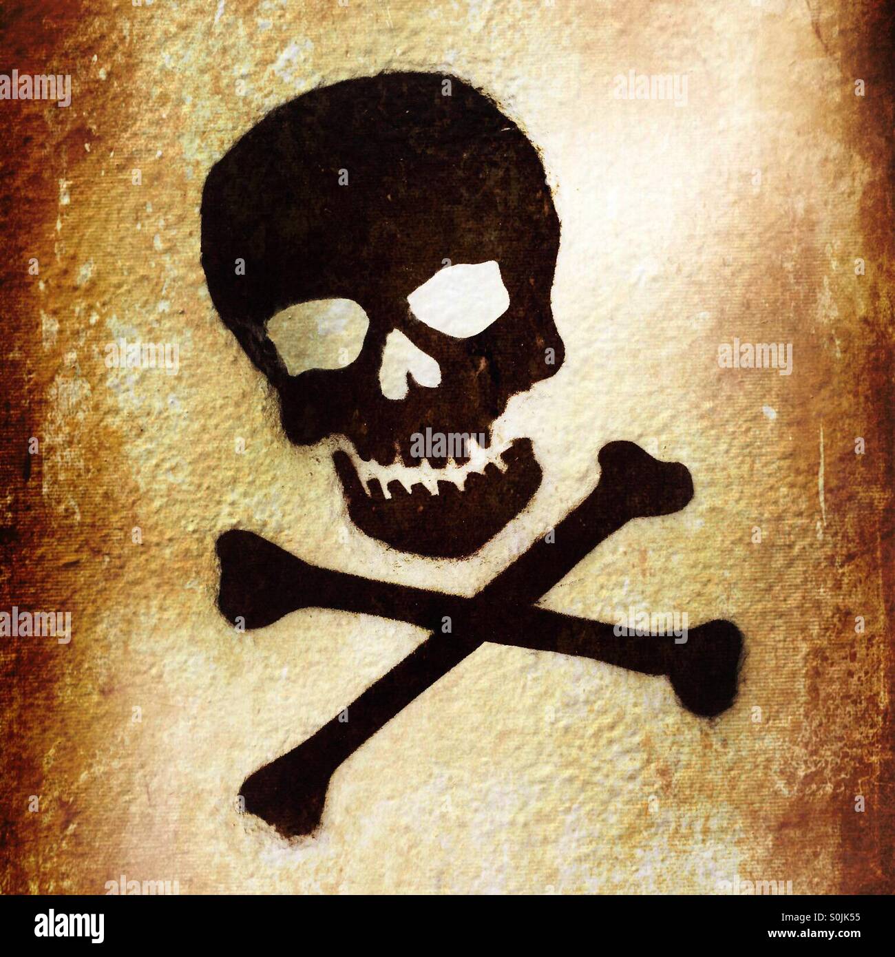 Skull and crossbones graffiti on wall - Smartphone Captured Stock Image