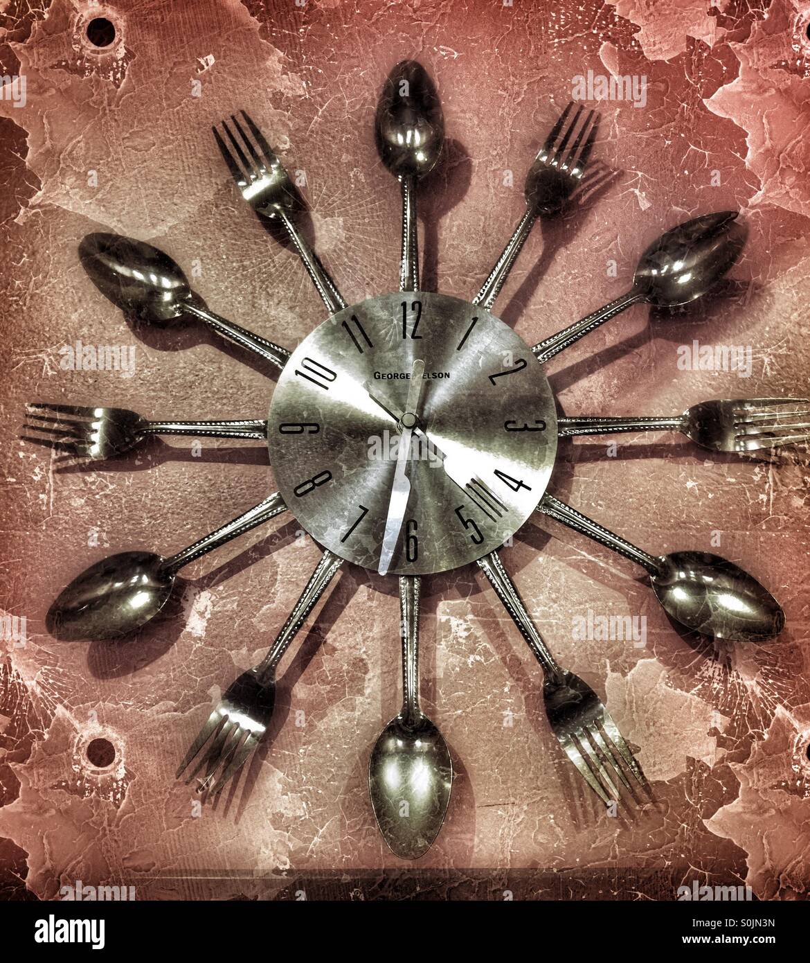 Clock made of forks and spoons Stock Photo