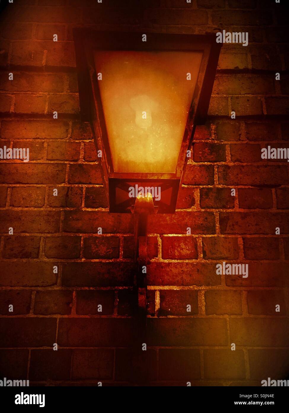 Orange glow of old fashioned street light. - Smartphone Captured Stock Image