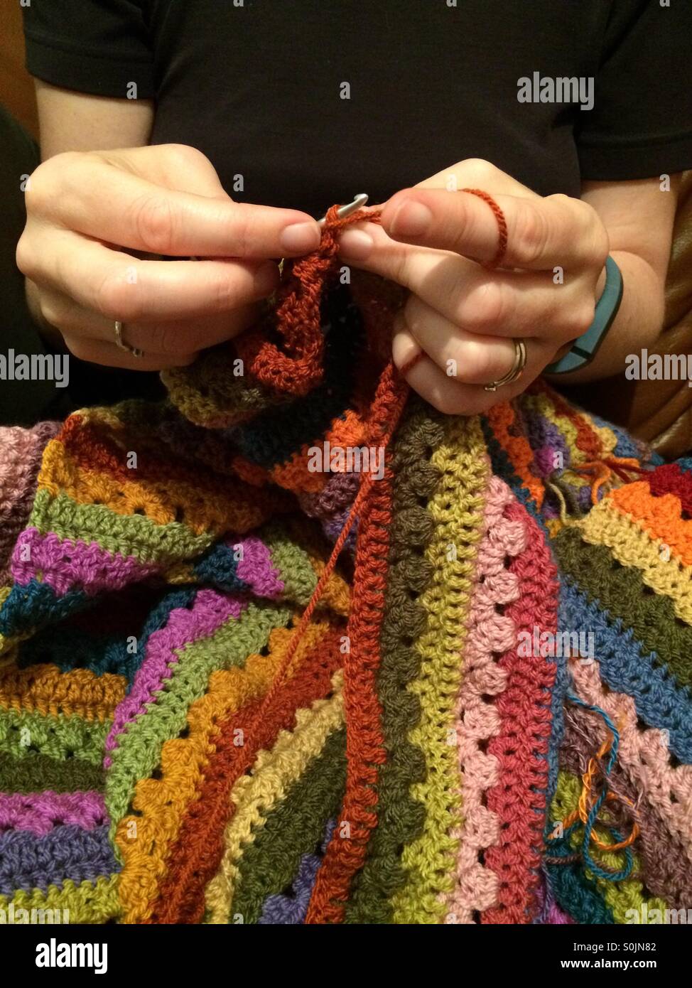 Hands crocheting Stock Photo
