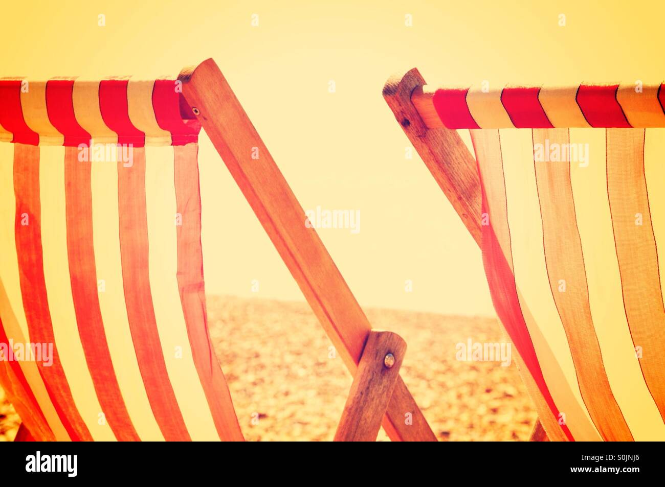 Two deck chairs on Brighton beach UK Stock Photo - Alamy