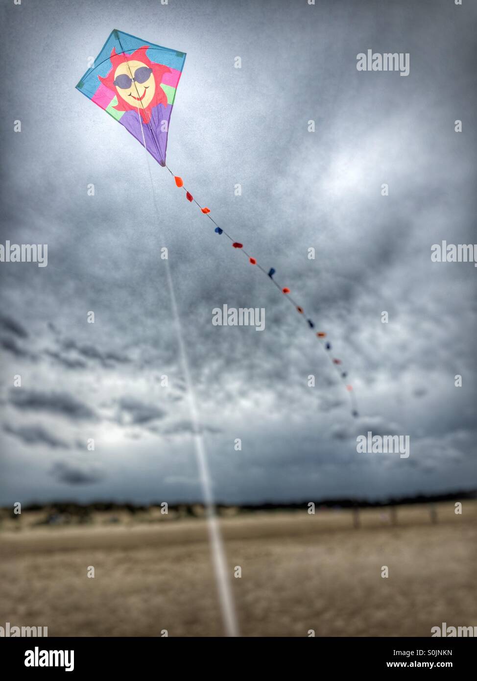 Holiday kite flying on a beach in the UK Stock Photo Alamy
