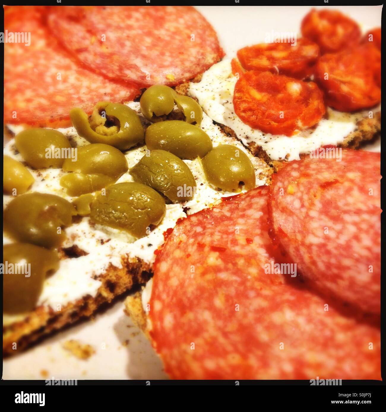 Olives and salami Stock Photo Alamy