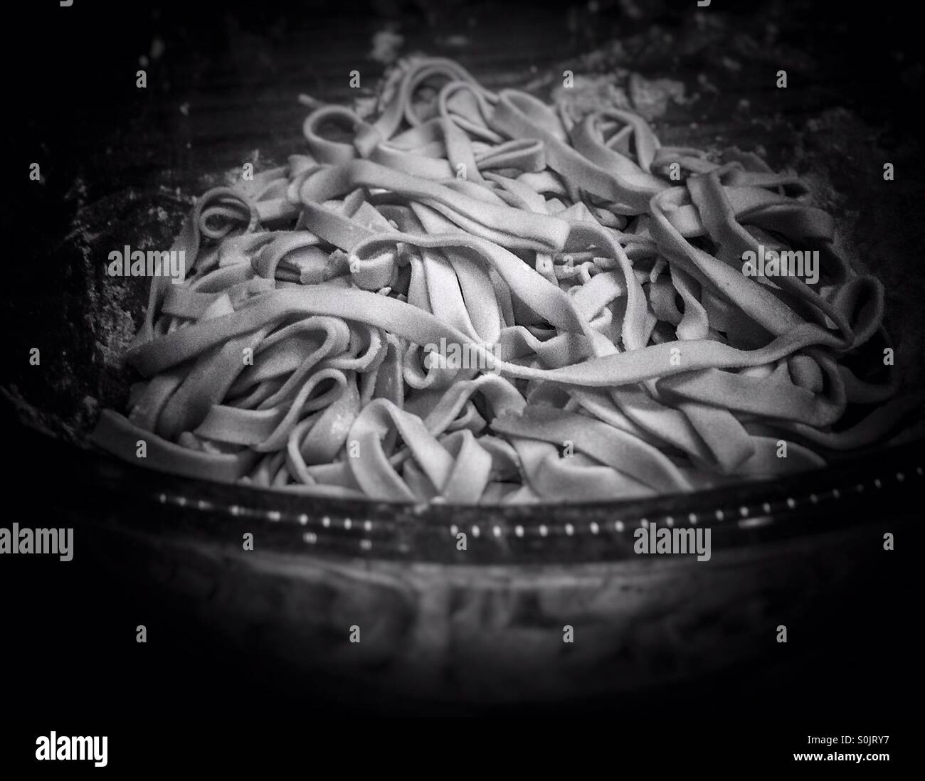 Fresh home made uncooked gluten free tagliatelle pasta - Smartphone Captured Stock Image