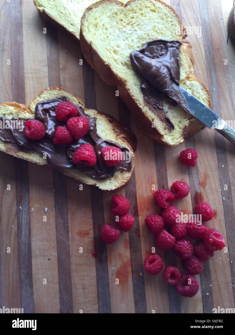 Raspberry and chocolate hazelnut spread sandwich with copy space Stock Photo Alamy