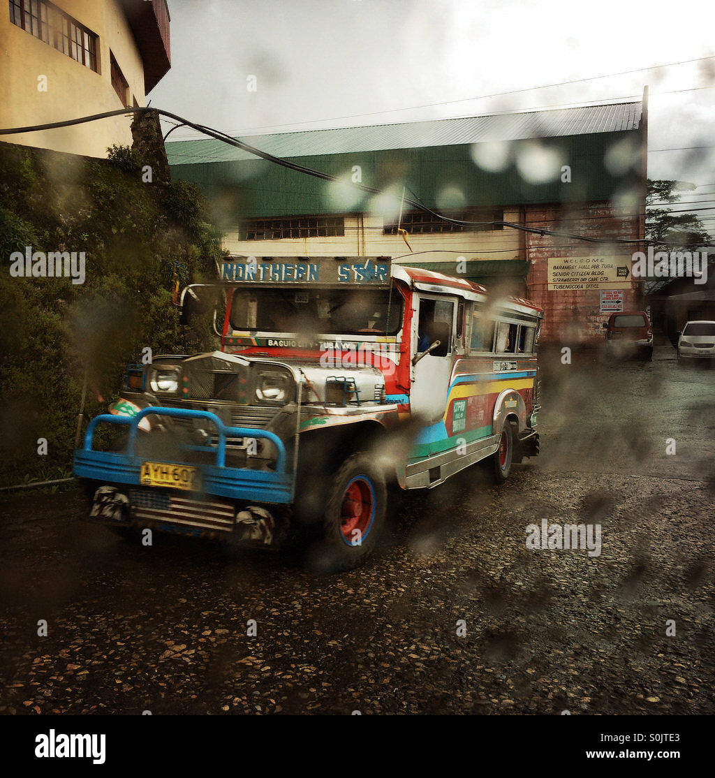 Jeepney, the philippine public transport system. Rainy weather. Stock Photo