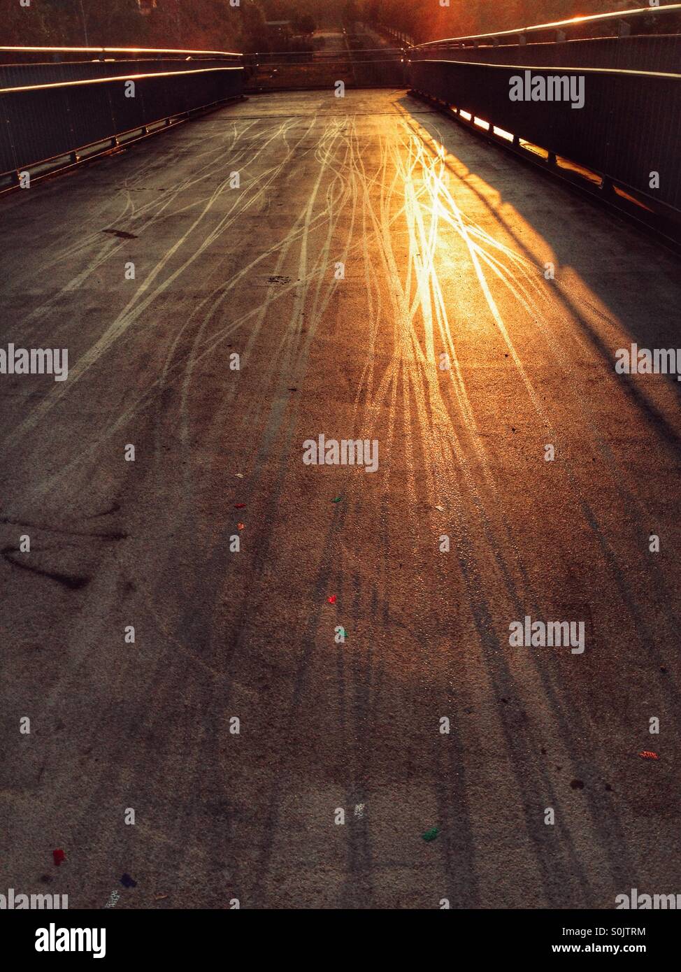 Bicycle Tracks on a bridge in the Berlin District neukoelln at dawn, signs of commuting by bike - Smartphone Captured Stock Image