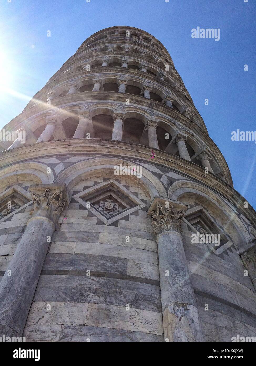 Upward glance of the leaning Tower of Pisa Stock Photo