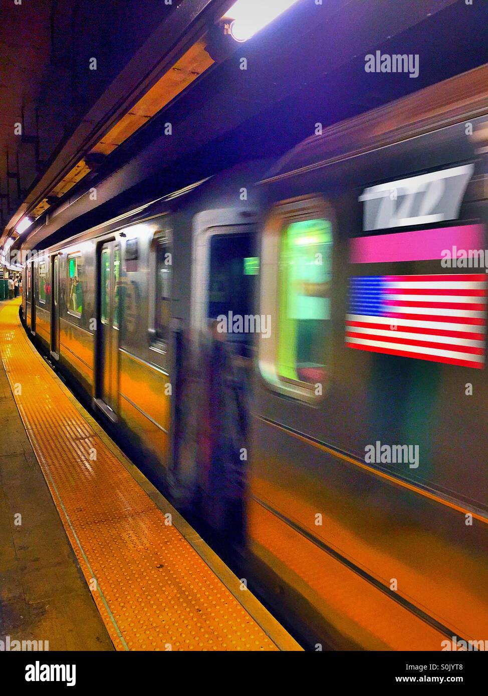 Six subway train arrives at Astor Place station, New York City. - Smartphone Captured Stock Image