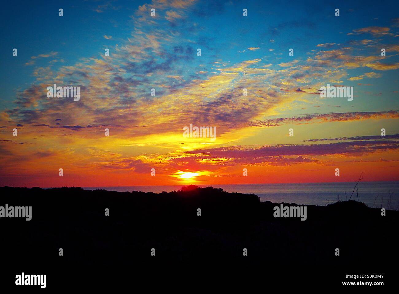 Early morning sunrise across the Mediterranean Sea from Menorca - Smartphone Captured Stock Image