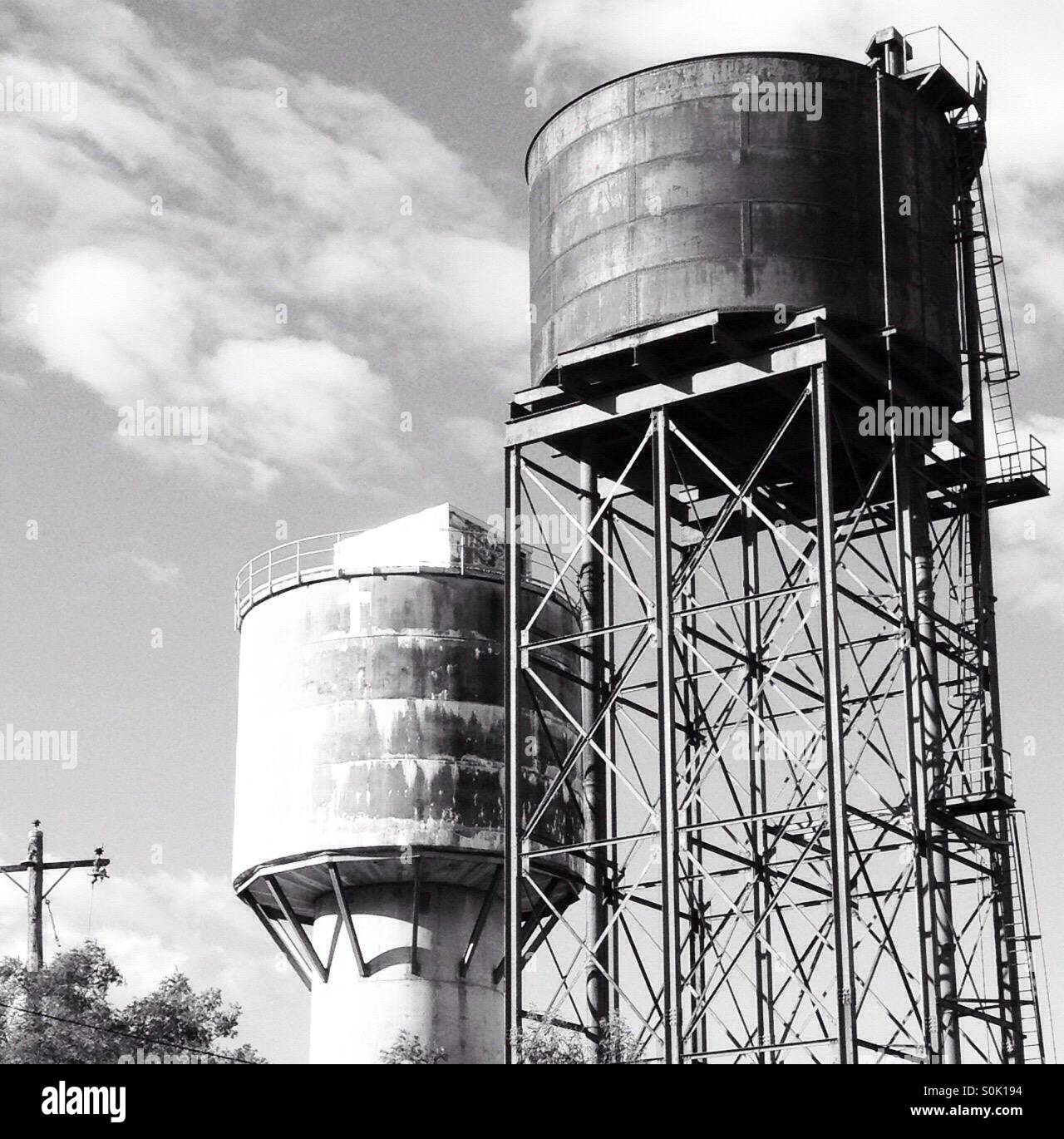 Elevated water storage towers with clouds in the background monochrome image - Smartphone Captured Stock Image