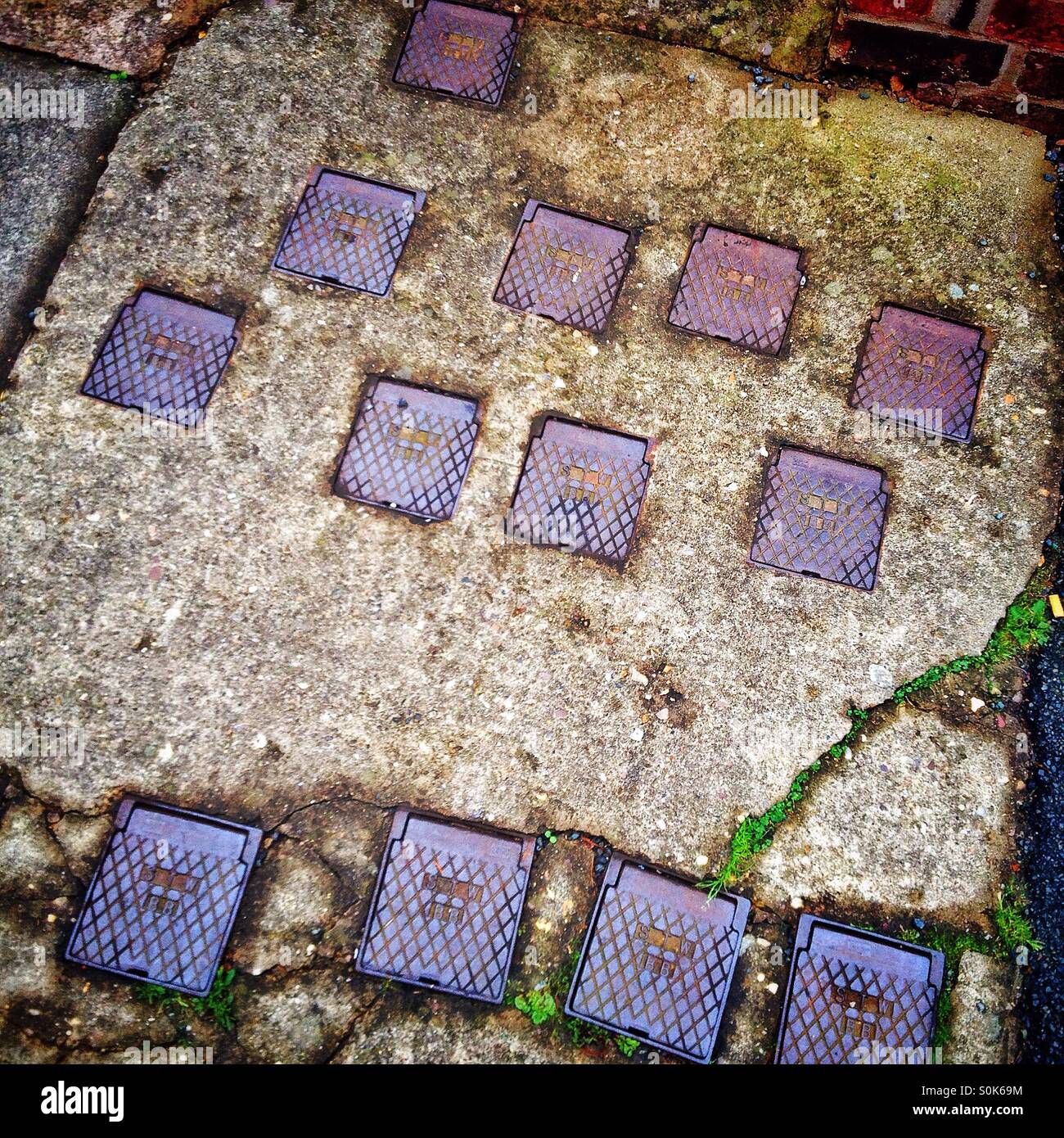 Stopcock covers on pavement Stock Photo