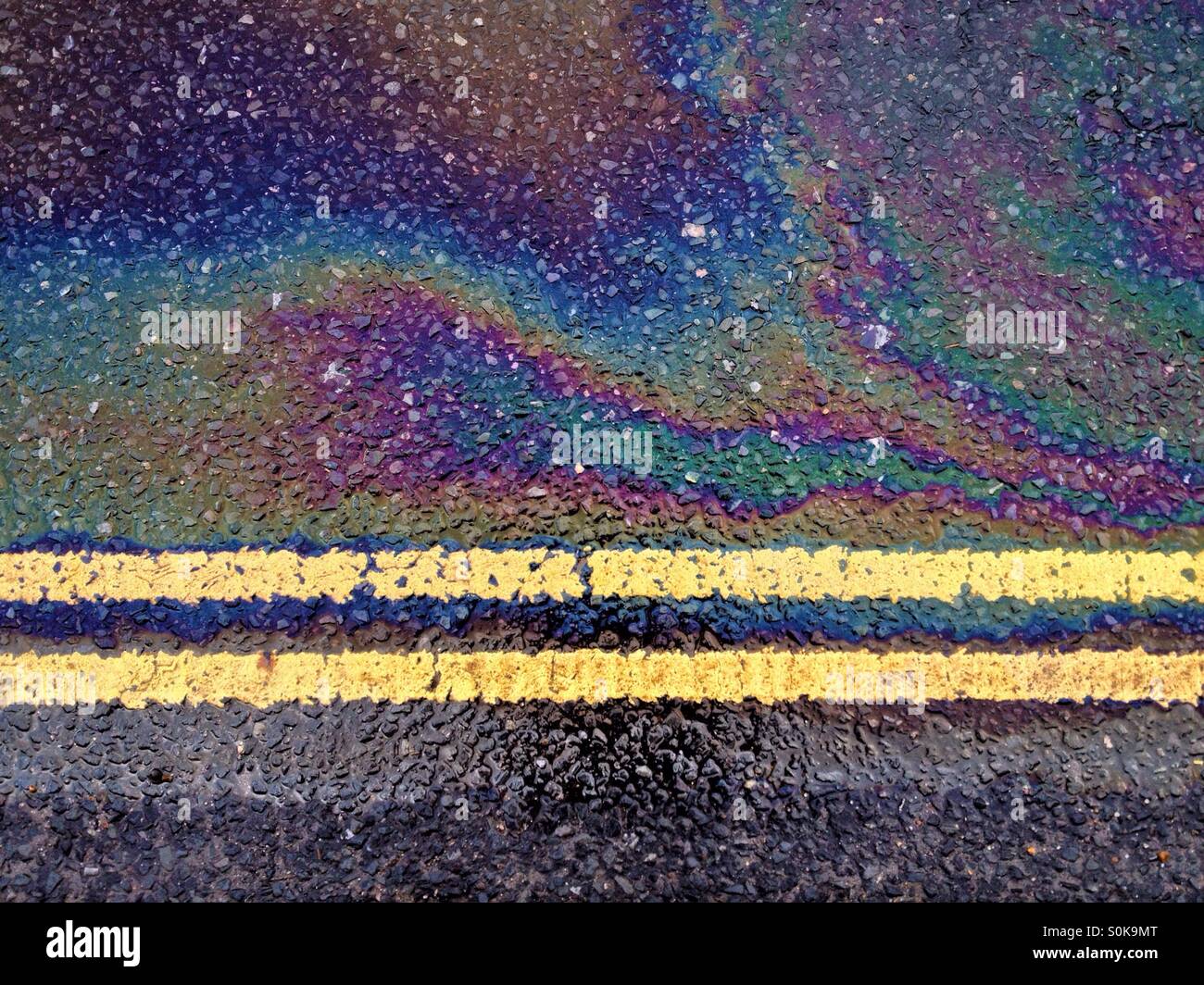 Details of road markings and oil spill Stock Photo Alamy