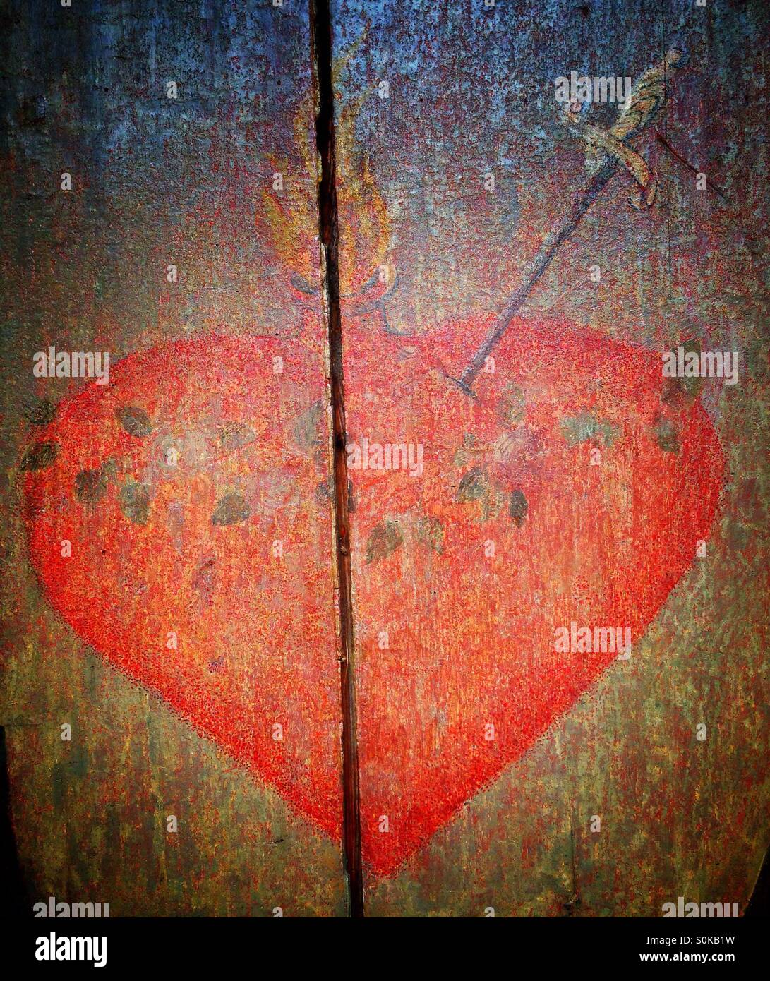 Burning pierced heart - Smartphone Captured Stock Image