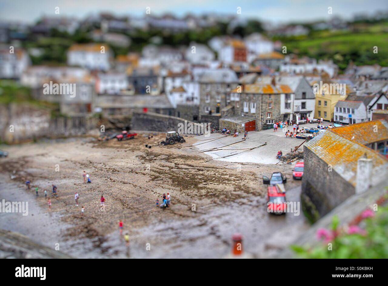 Port Isaac harbour and beach in Cornwall with a tilt shift effect to make the scene look like a model village. Stock Photo