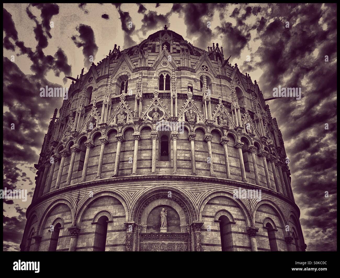 Storm Clouds Brewing Over The Baptistery in The Field of Miracles, Pisa, Tuscany, Italy. This Is the Largest Baptistery in Italy and is a UNESCO World Heritage Site. Photo Credit - COLIN HOSKINS. - Smartphone Captured Stock Image