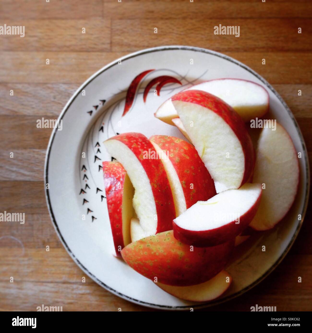 Sliced Apple on vintage dish Stock Photo